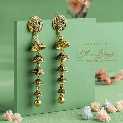 antique multi layer dangle earrings green background